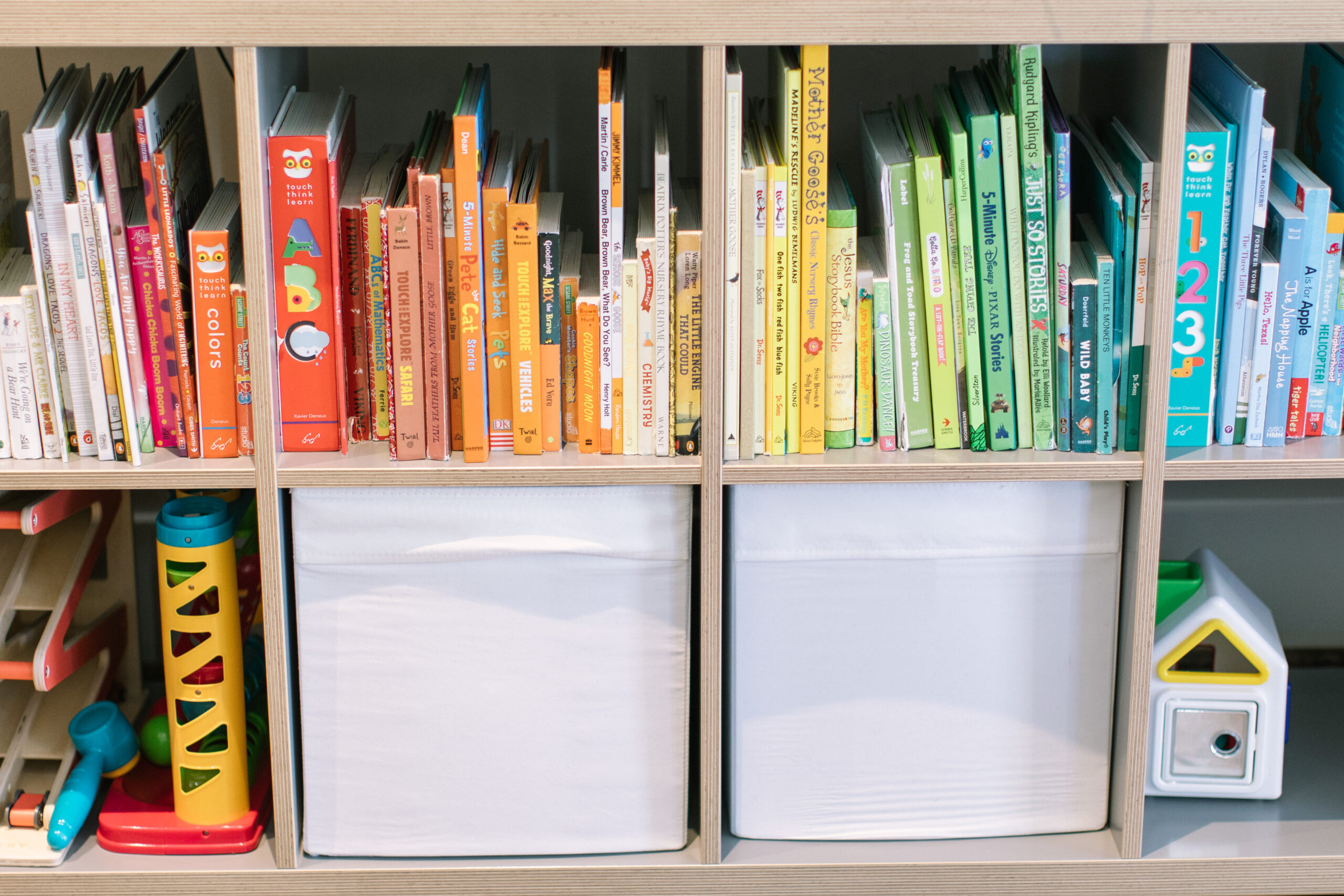 colored coded kids book and toy shelf