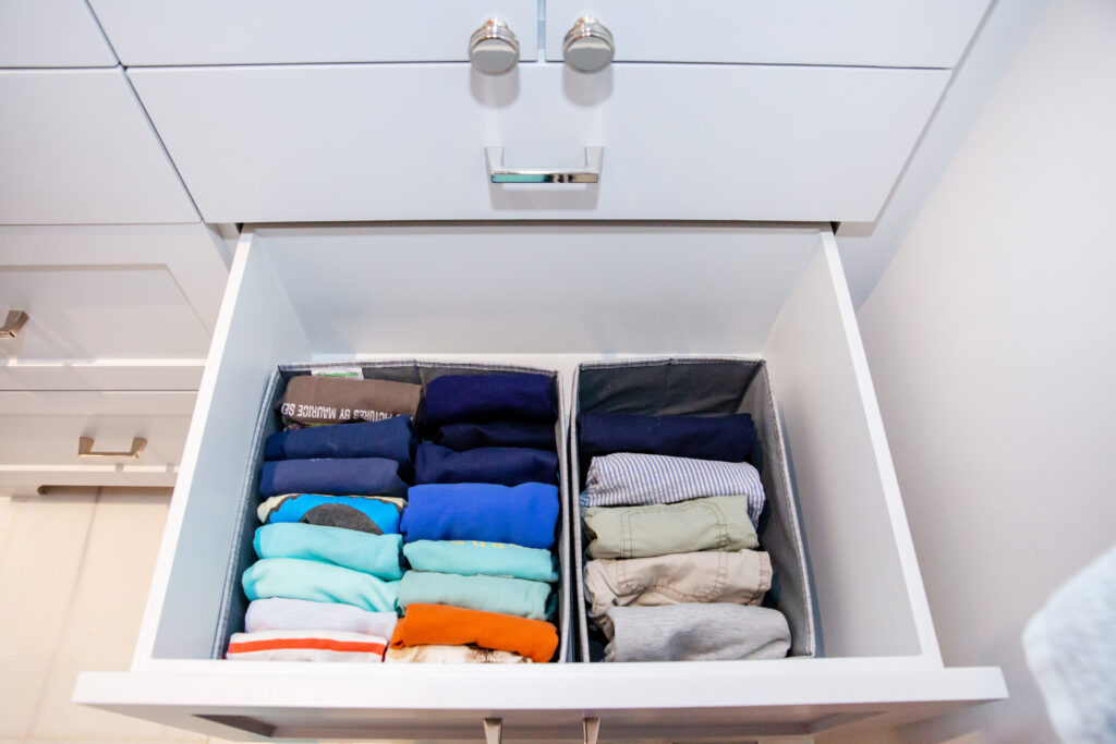 Clothes in drawers color coordinated