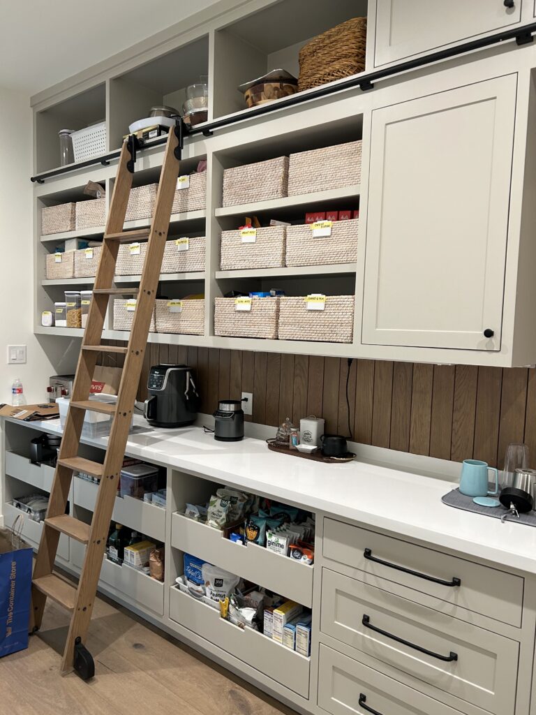 Labeled kid and adult zones in a Houston pantry, whole-family organizing systems by Wildely Organized