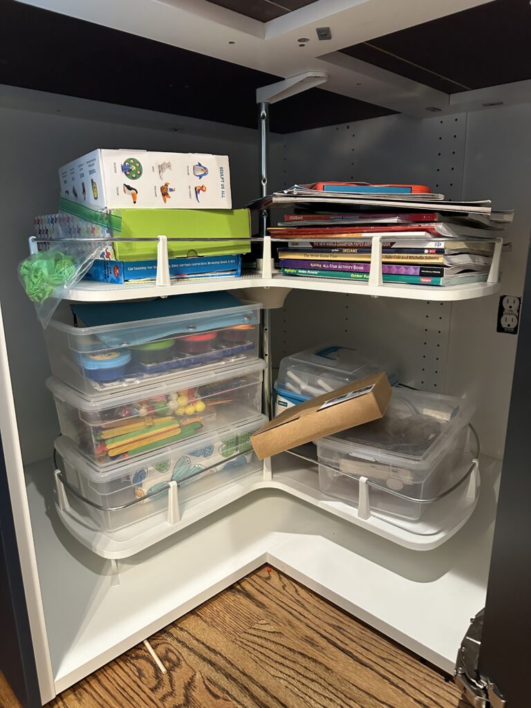 Playroom before organization in Houston TX, mixed toy bins and shelving above child height